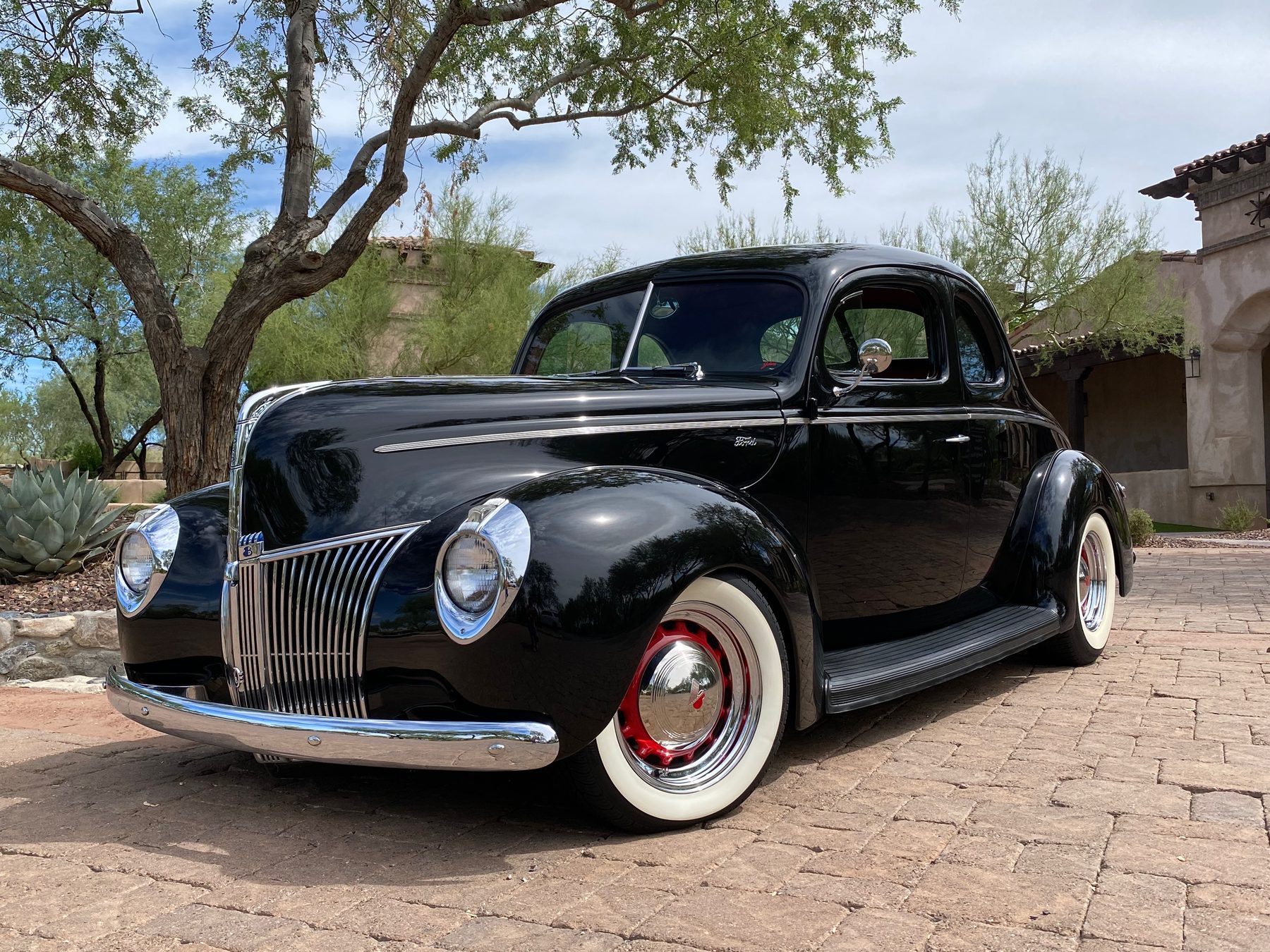 1940 Ford Standard Coupe in Sikkens Obsidian Black, front three-quarter view