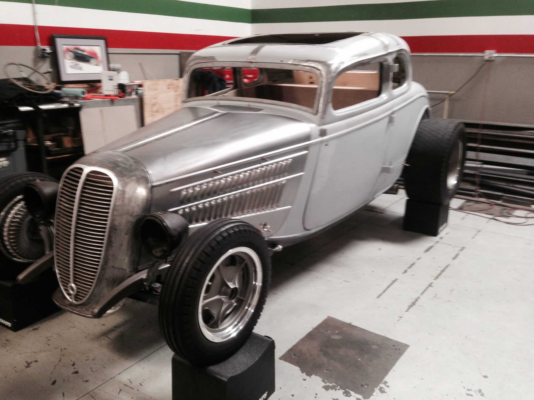 Front three-quarter, bare metal, sunroof insert visible