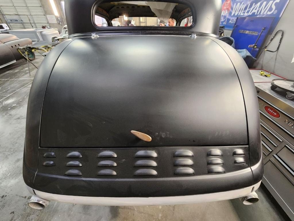 Rear deck in primer, dual exhaust tips