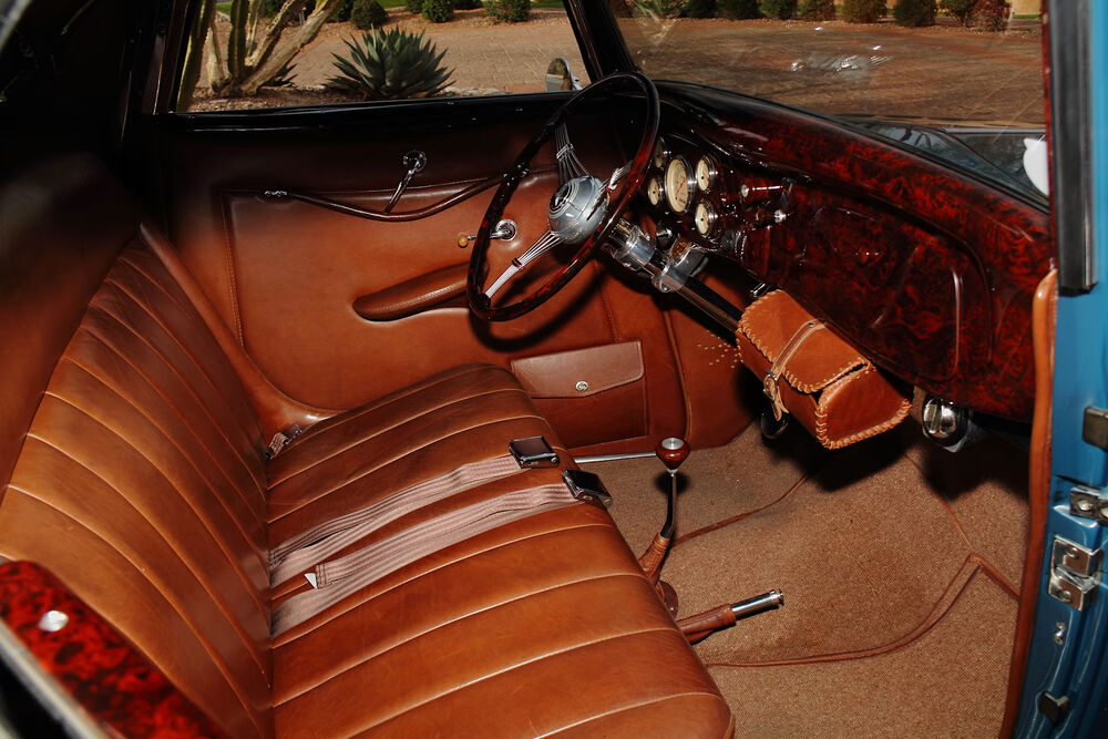 Dashboard with woodgrain, banjo wheel, and Classic Instruments gauges